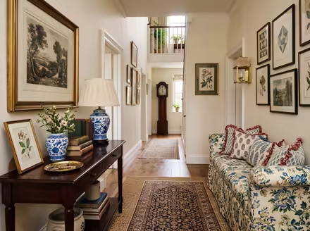 AI-generated grandmillennial hallway interior design: skirted and rolled-arm seating
