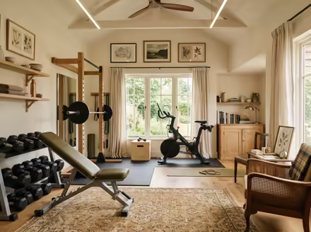 AI-generated light academia home gym interior design: vintage-inspired furniture in lighter woods