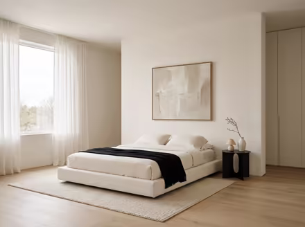 AI-generated minimalist bedroom interior design: an almost empty room done perfectly: one exceptional low sofa in off-white