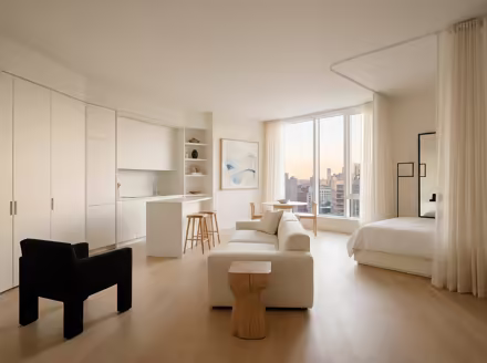 AI-generated minimalist studio apartment interior design: an almost empty room done perfectly: one exceptional low sofa in off-white