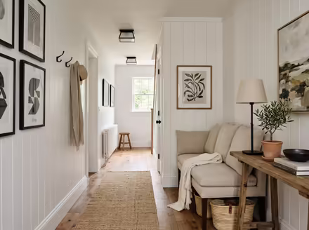 AI-generated modern farmhouse hallway interior design: white shiplap-style wall paneling