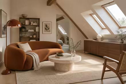 AI-generated scanditalia attic interior design: Scandinavian restraint with Italian warmth: one curved sofa in terracotta or ochre boucle