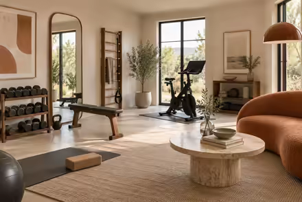 AI-generated scanditalia home gym interior design: Scandinavian restraint with Italian warmth: one curved sofa in terracotta or ochre boucle