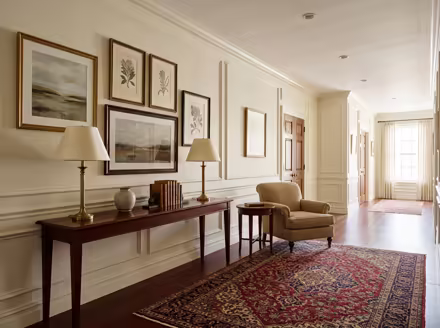 AI-generated traditional hallway interior design: a classic rolled-arm sofa in warm neutral upholstery