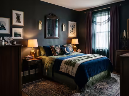 AI-generated whimsigoth bedroom interior design: a velvet sofa in inky plum